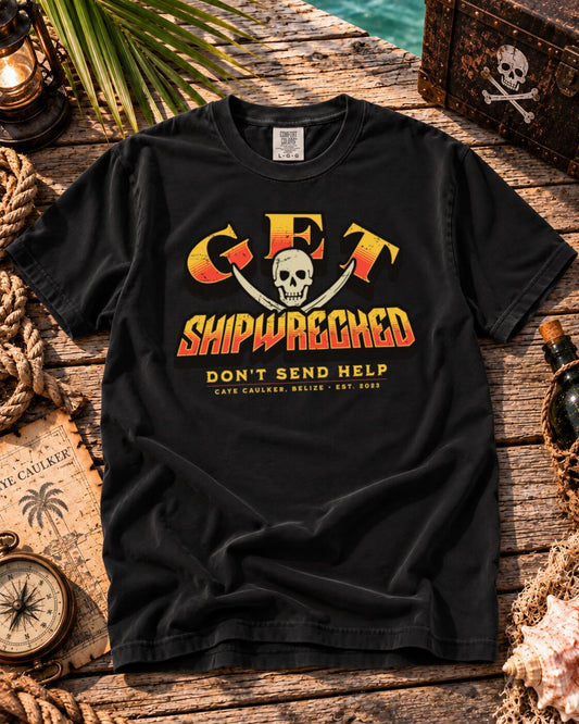 Black Get Shipwrecked Rocker Tee flat lay with orange and yellow skull-and-cutlasses artwork