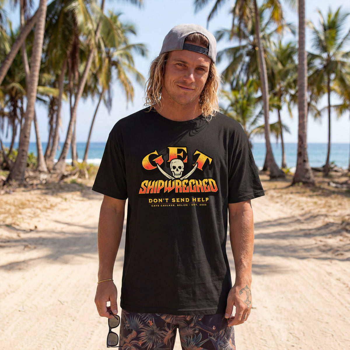 Alternate front view of the black Get Shipwrecked Rocker Tee on a model